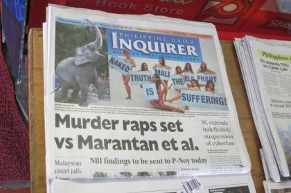 Philippines, Manila - naked girls sells newspaper